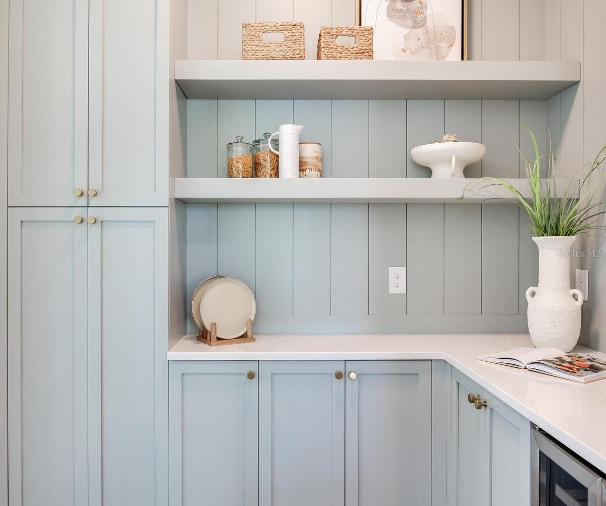 butlers pantry provides much additional storage and counter space