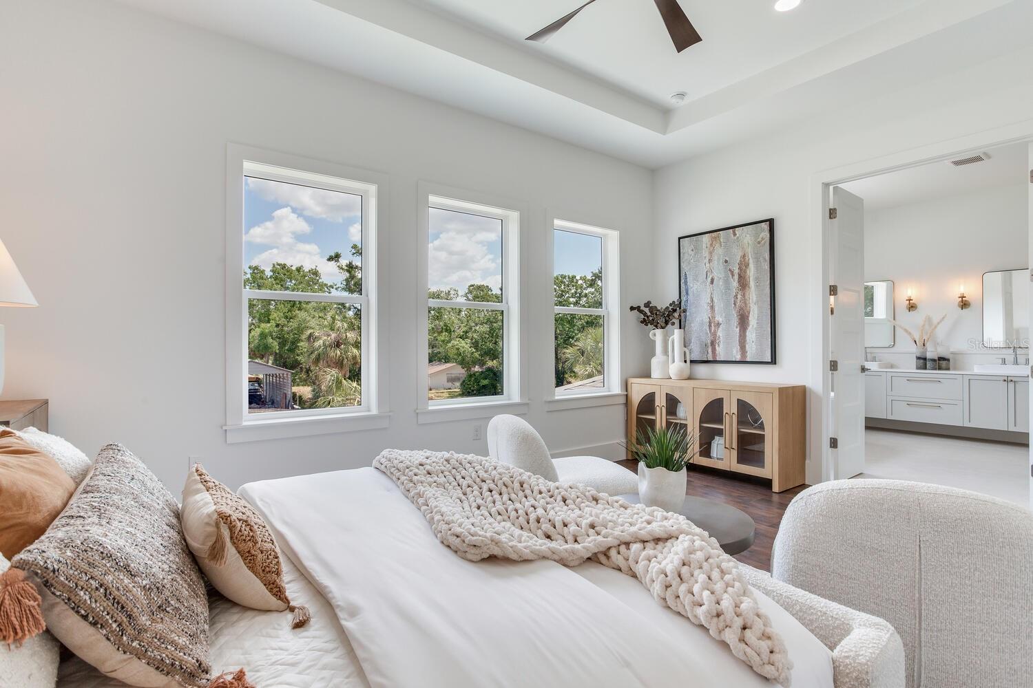 Primary suite also shows double entry doors to the bath area