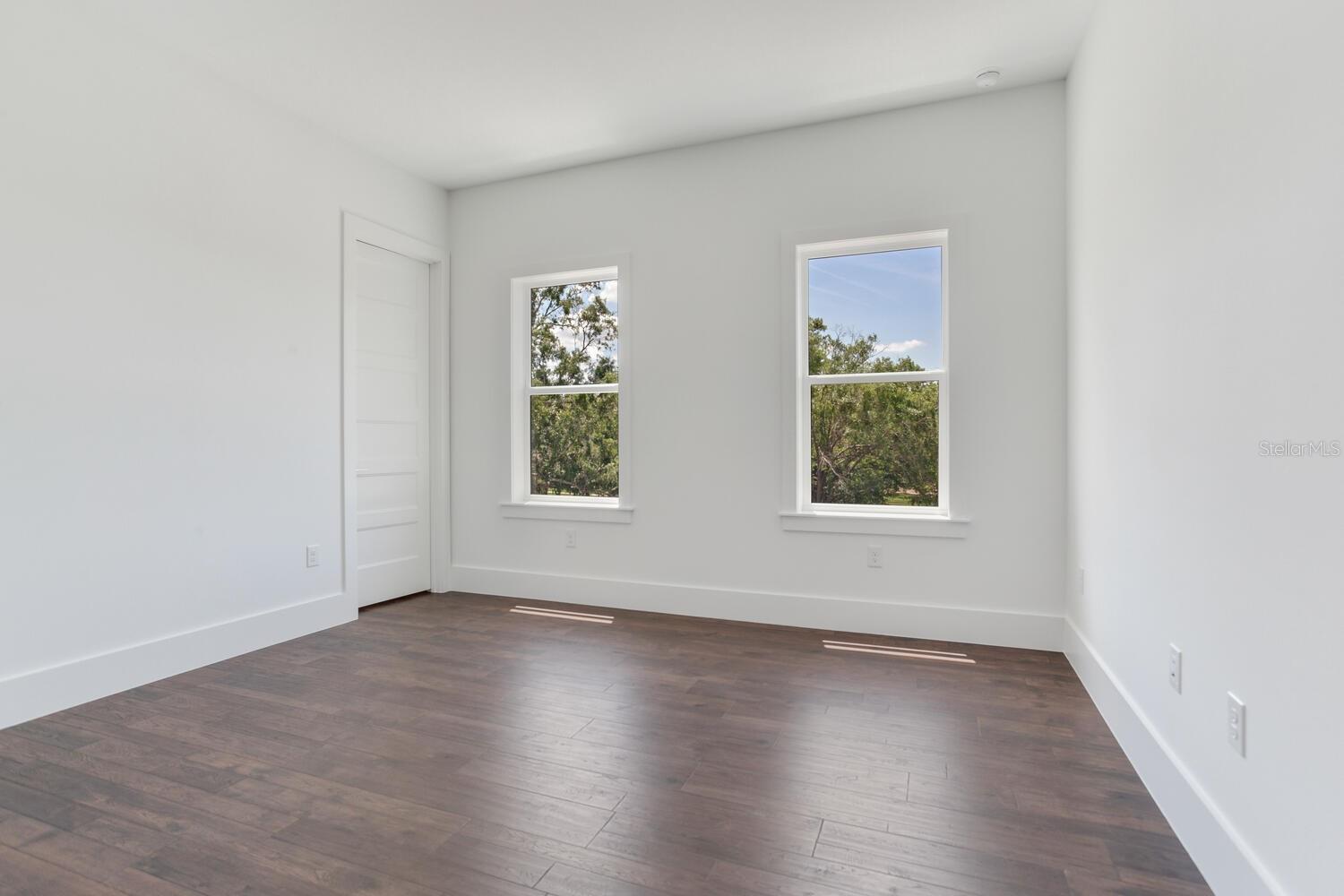 Bedroom 4 on the second floor is filled with natural light and ample space