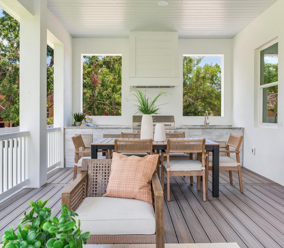 highlighted with composite decking and sleek wood plank ceiling.