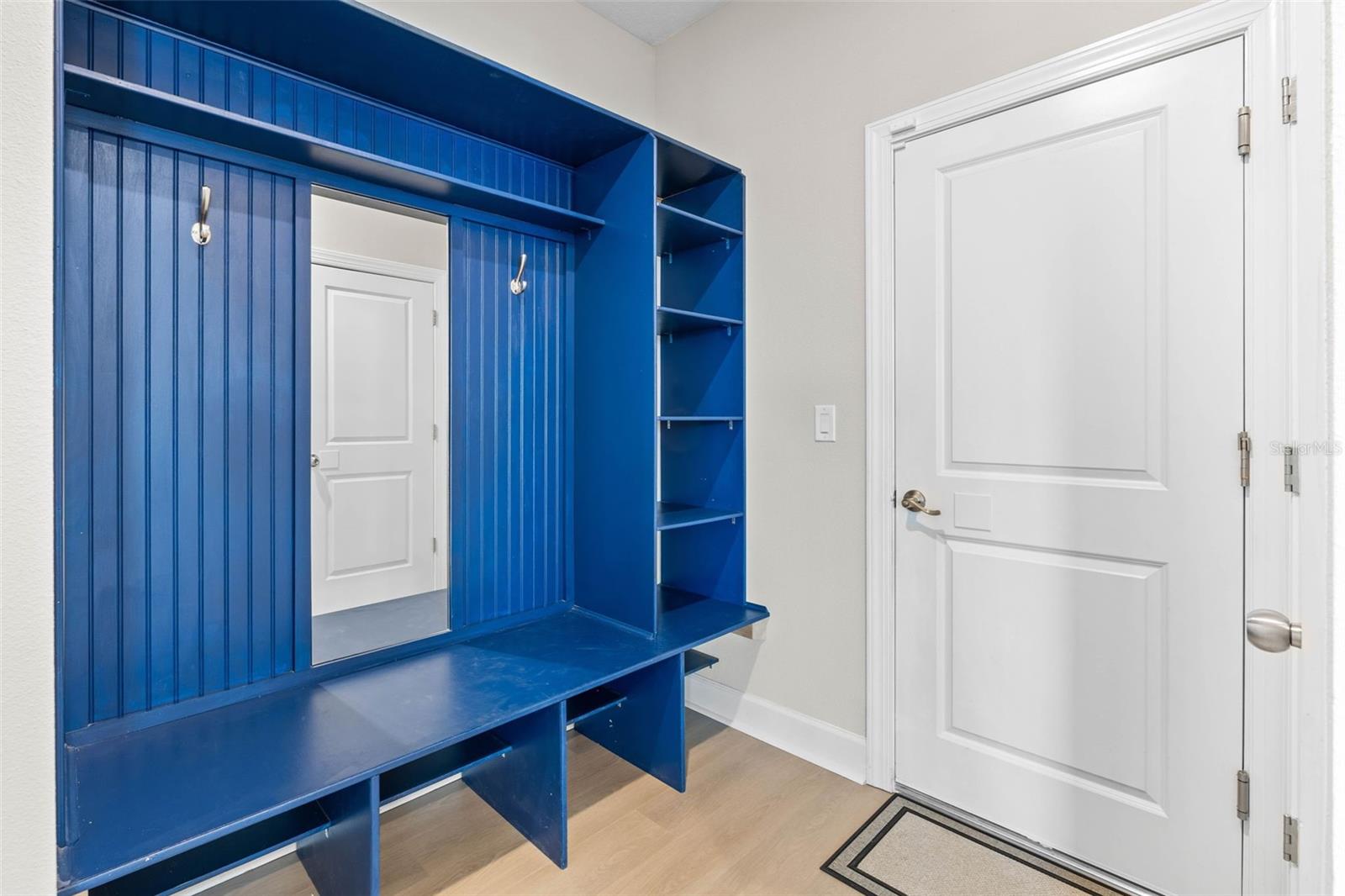 Catch all built in by the garage door offers additional storage just off the great room.