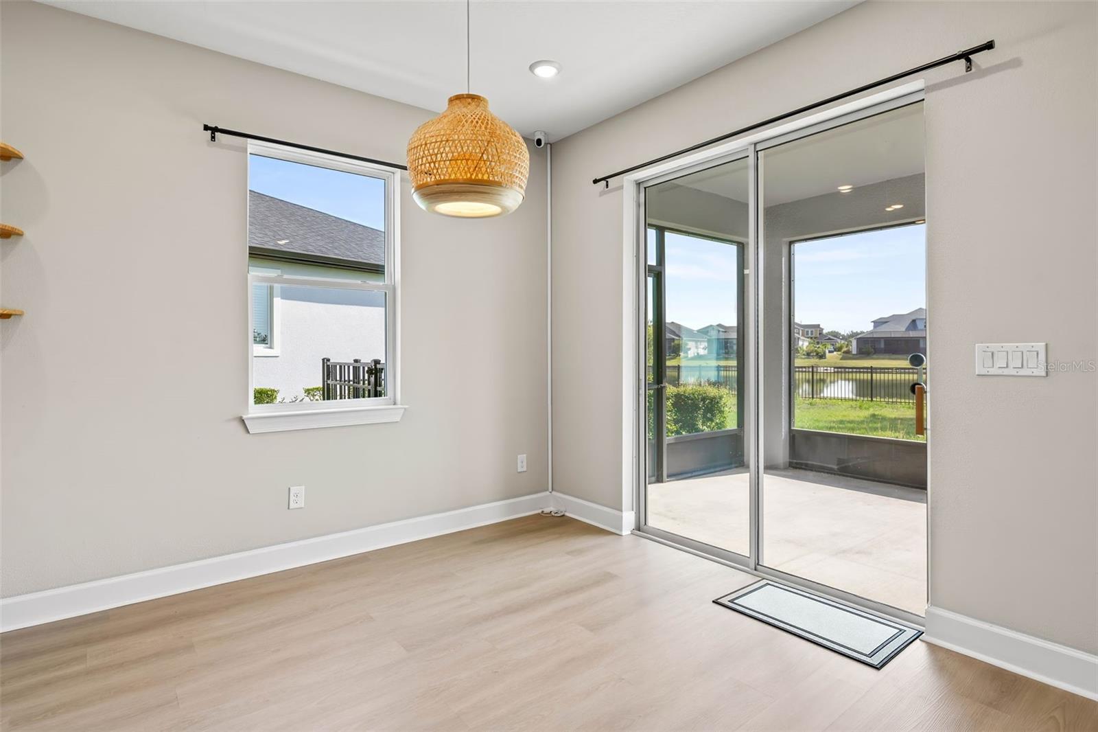 Dinette off of the kitchen with backyard view to the pond.