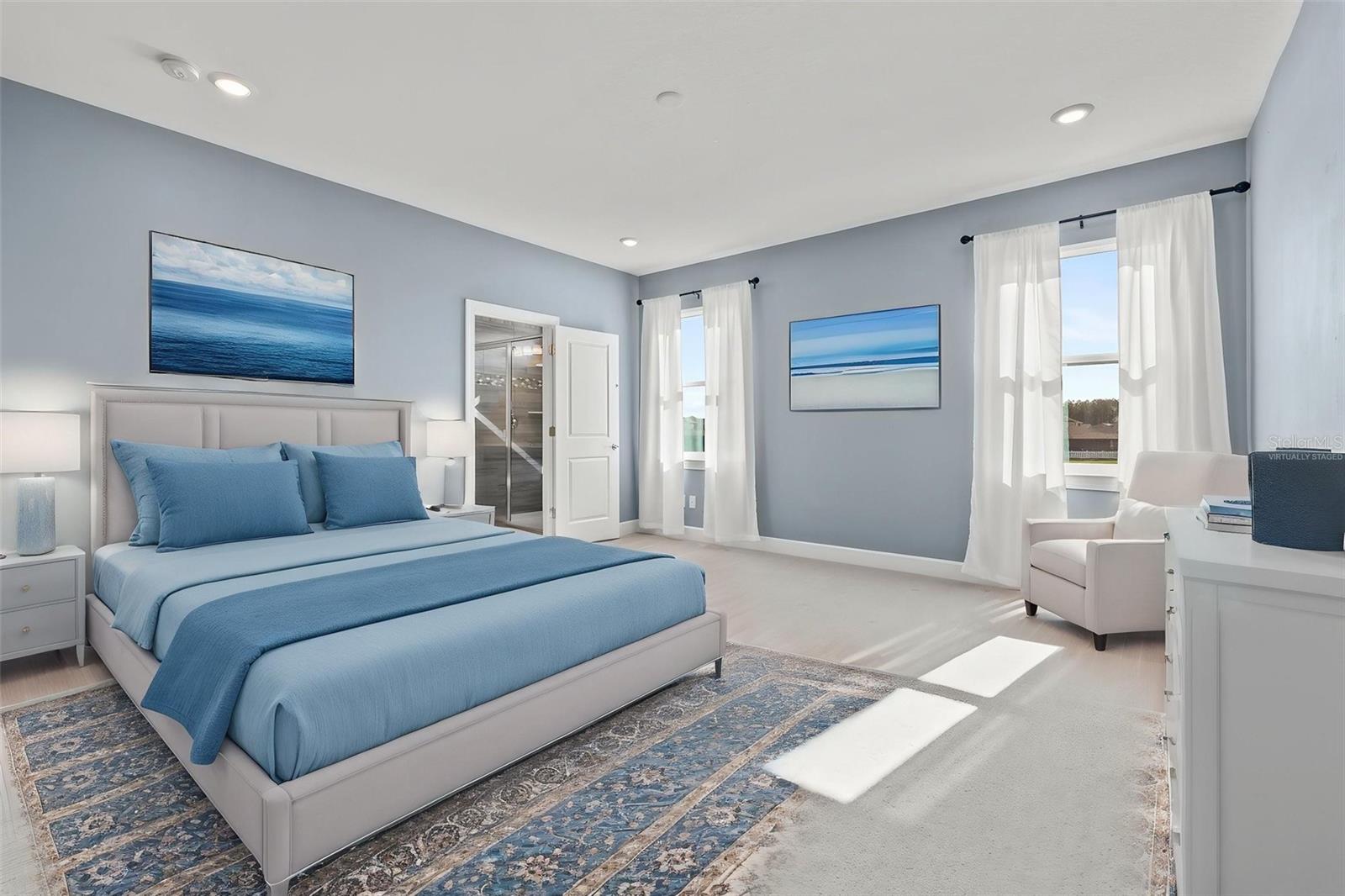Virtually staged- Primary suite with ensuite bath and walk in closet.