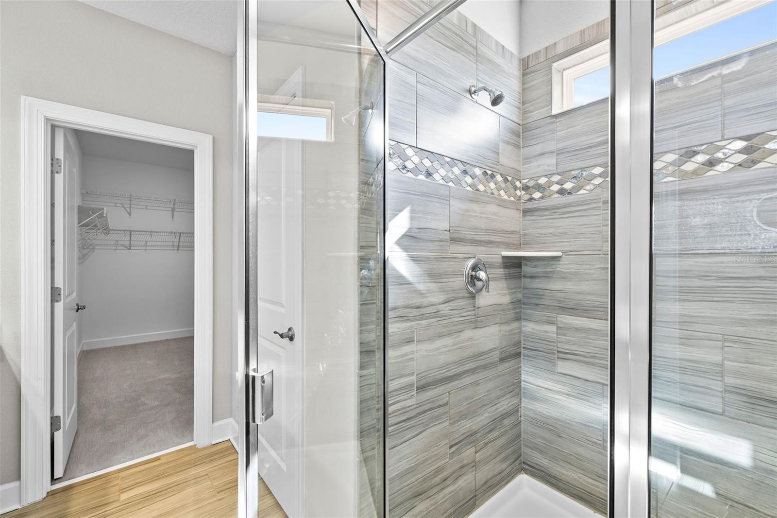 Step in shower to the primary bath.