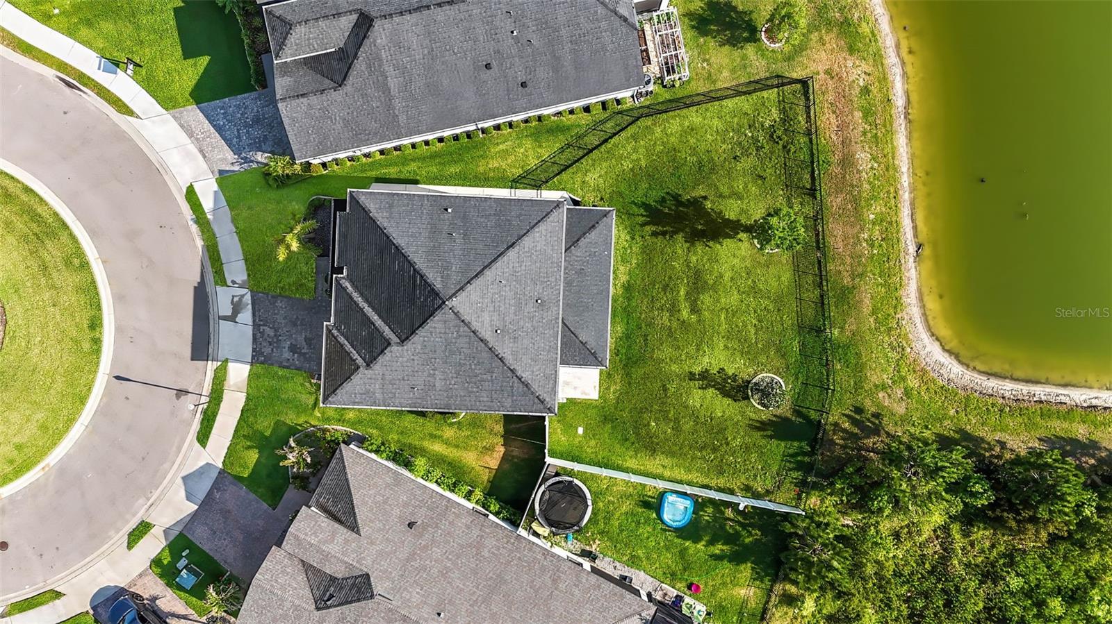 Pie shaped lot and added walking path from back to front yard.