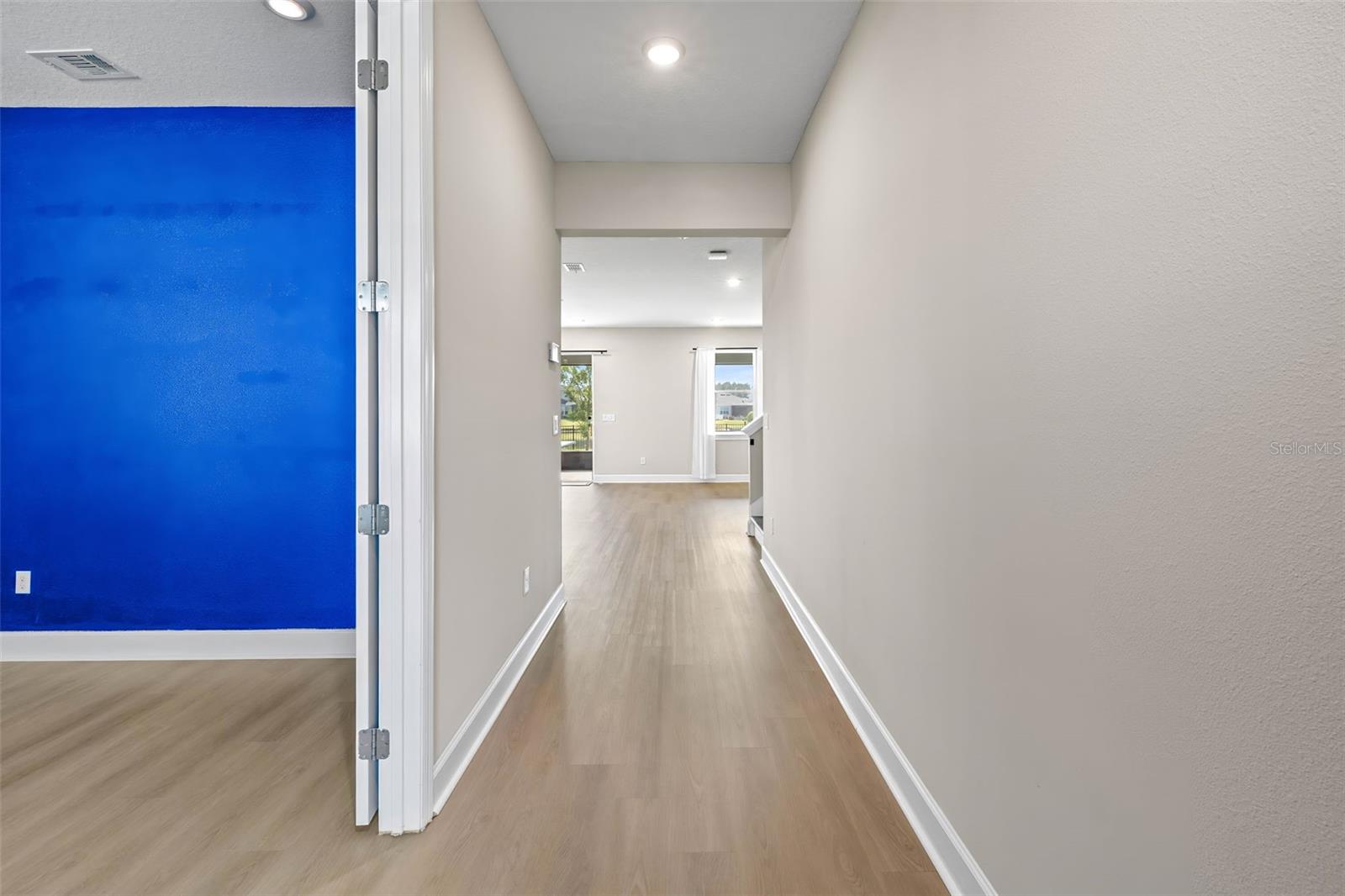 Entryway with brand new flooring and interior paint- immediately to your L is the office with accent wall.