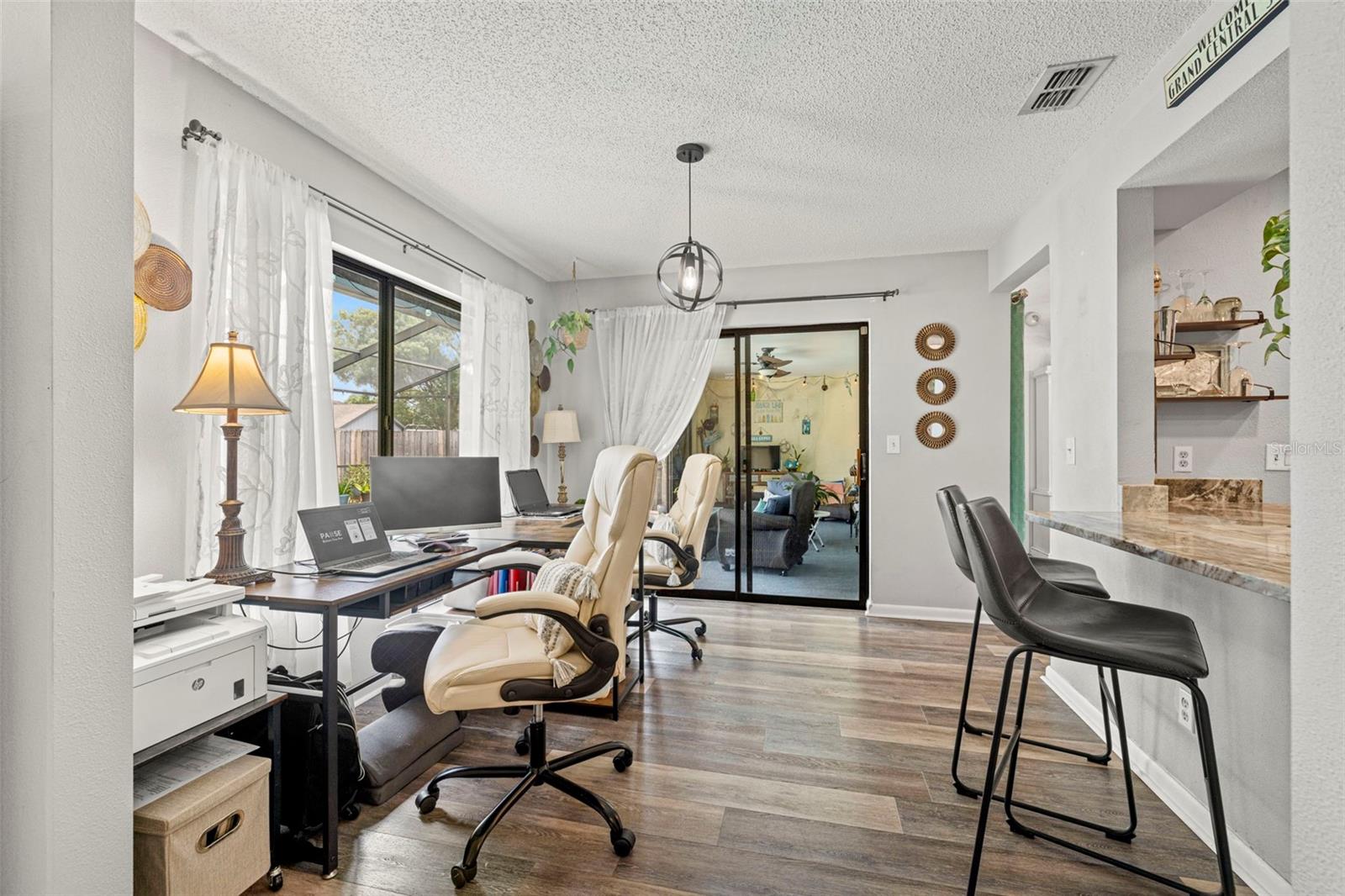 This flex space has so many options...informal dining area, homework station, hobby area or as it is currently used..a home office!