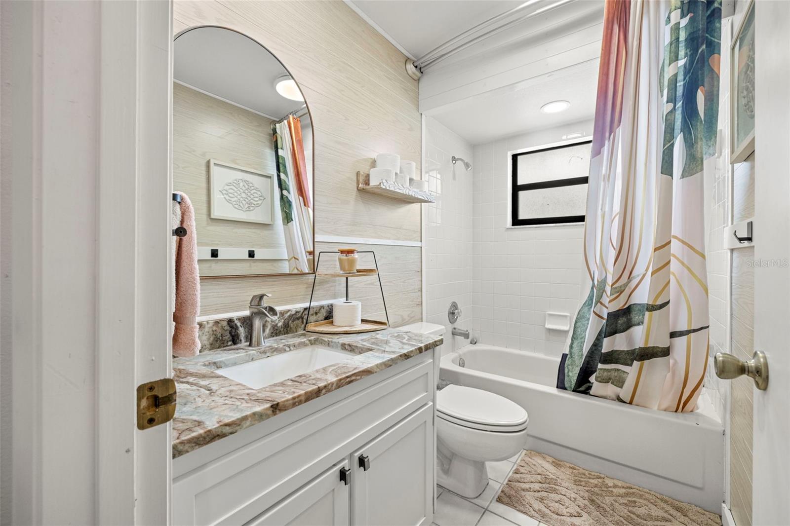 Secondary bathroom has been totally renovated as well with a full shower/tub, new vanity and fixtures!