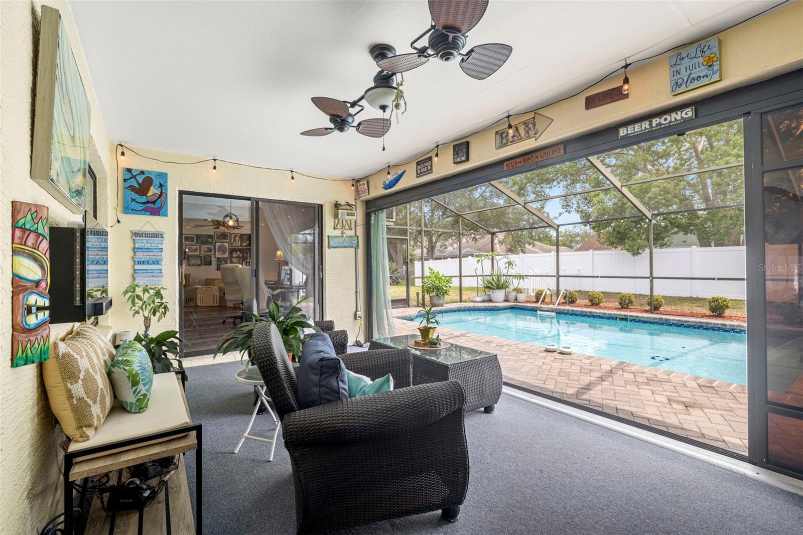 This lanai is a perfect example of Florida living!  This magical space is perfect for entertaining or just relaxing and enjoying the day!  So many possibilities here!  You'll never want to leave!
