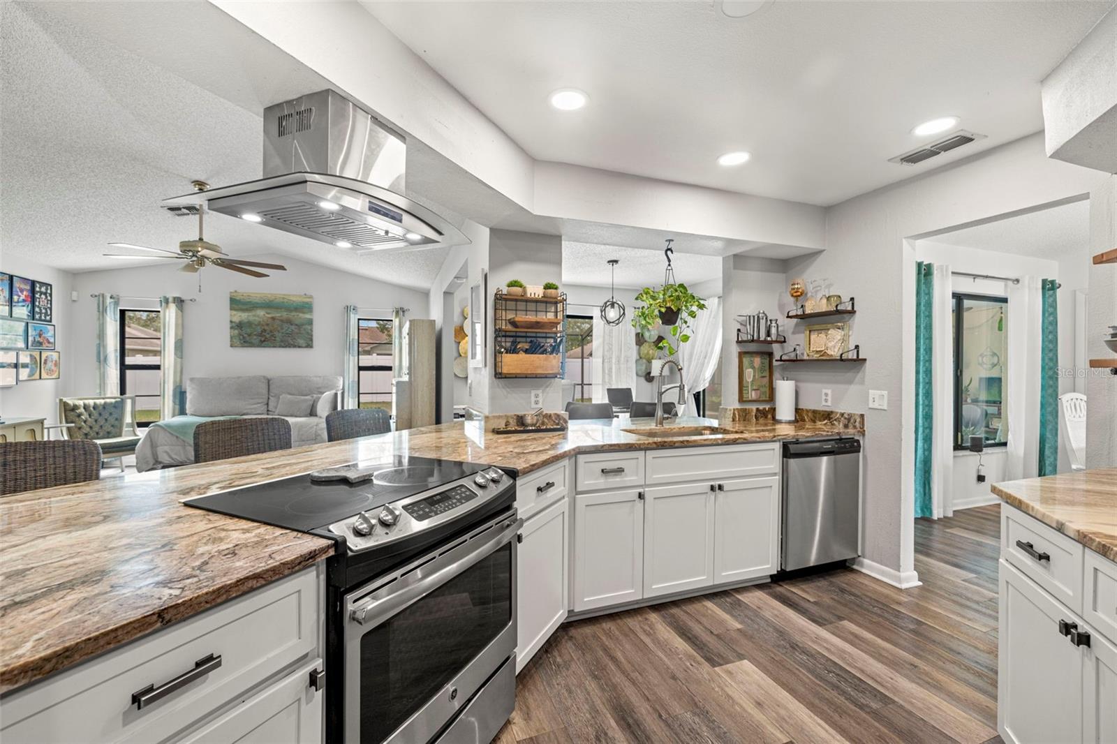 This home features a Gourmet kitchen with lots of prep space!  Features include recessed lighting, granite countertops, stainless steel appliance, deep sink and range/cooktop with hood!