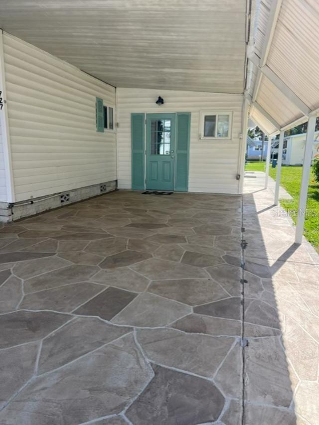 Carport and 2nd door to home.