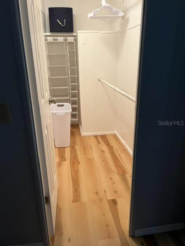 Large master bedroom closet with double hanging rods.