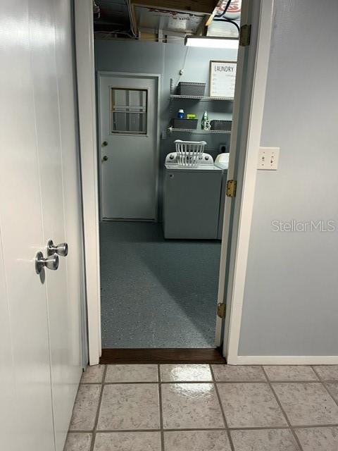 Entrance to upgraded and spacious laundry room.