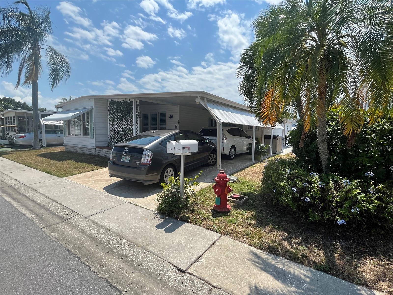 Two cars fit in carport.
