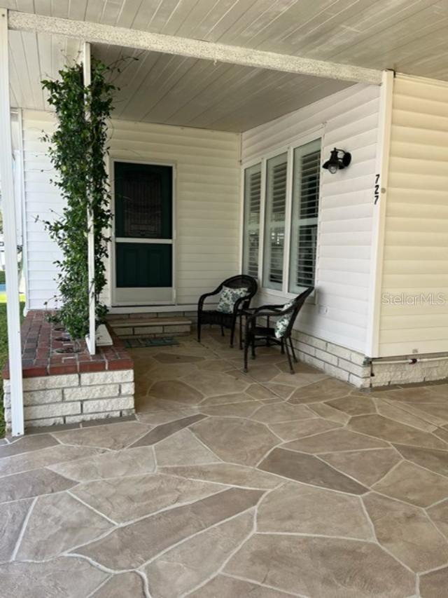 Carport, sitting area, and front door.