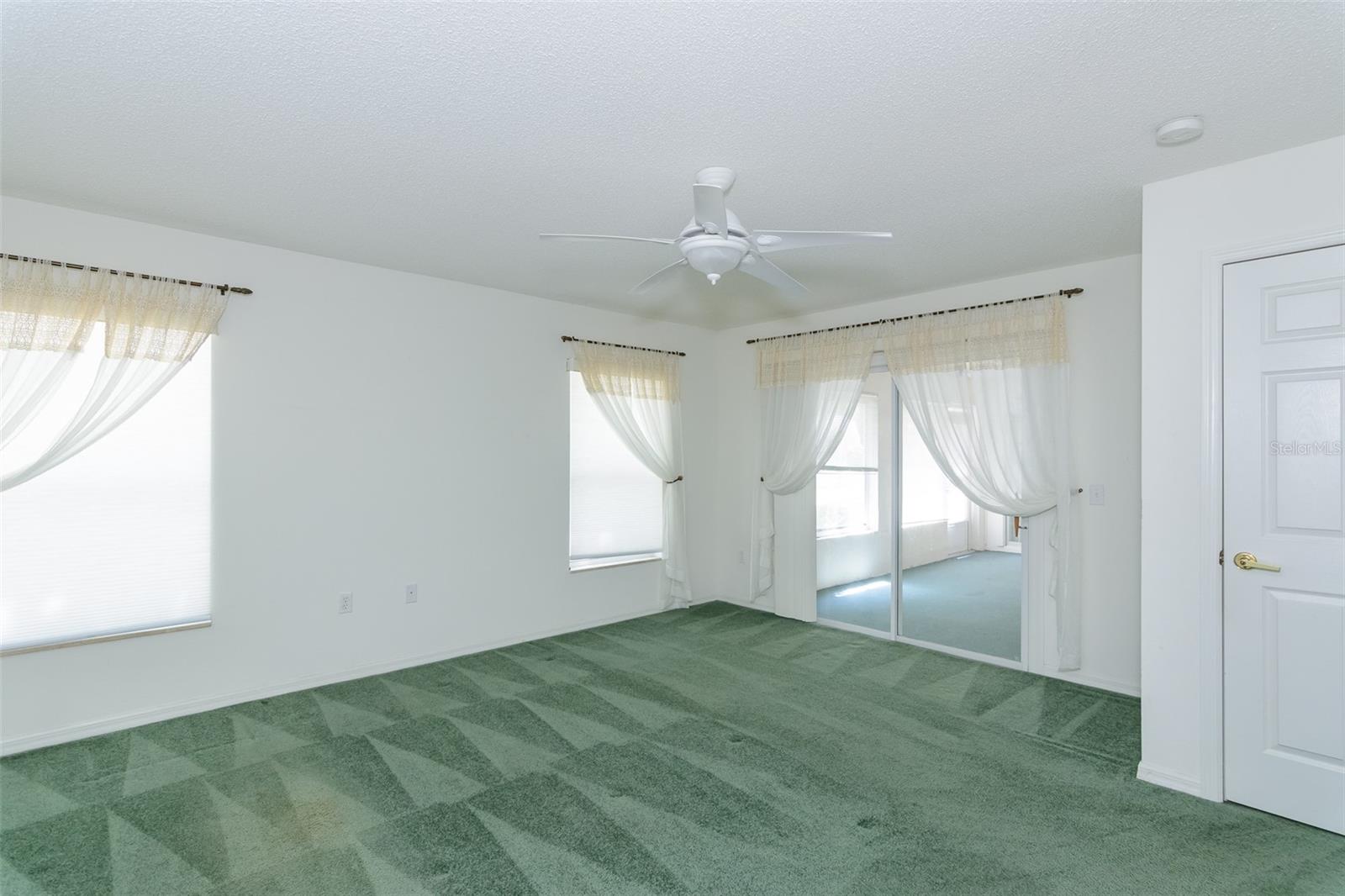 Primary BR w/ Sliding Glass Door to Patio
