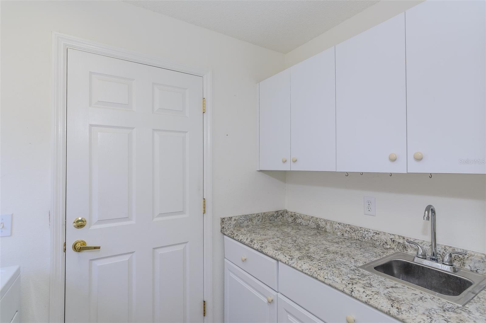 Interior Laundry Room w/ Cabinets & Sink