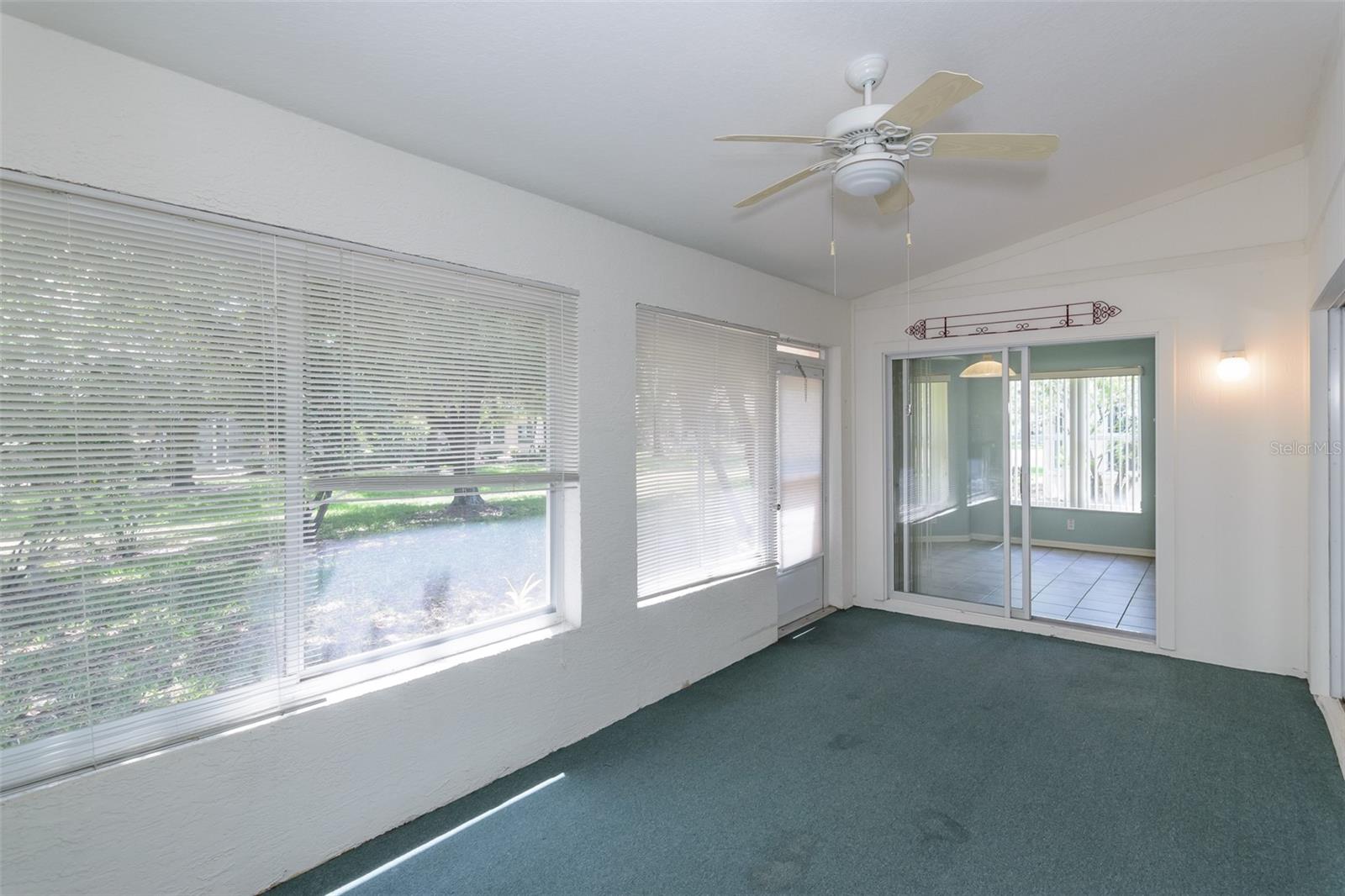 Sunroom w/ Sliding Glass Door to Eat In Kitchen