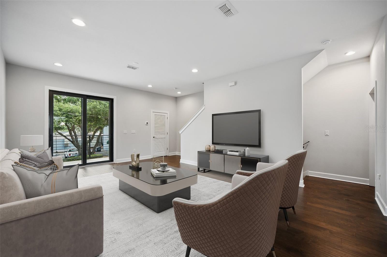 Virtually staged. Spacious living room with balcony