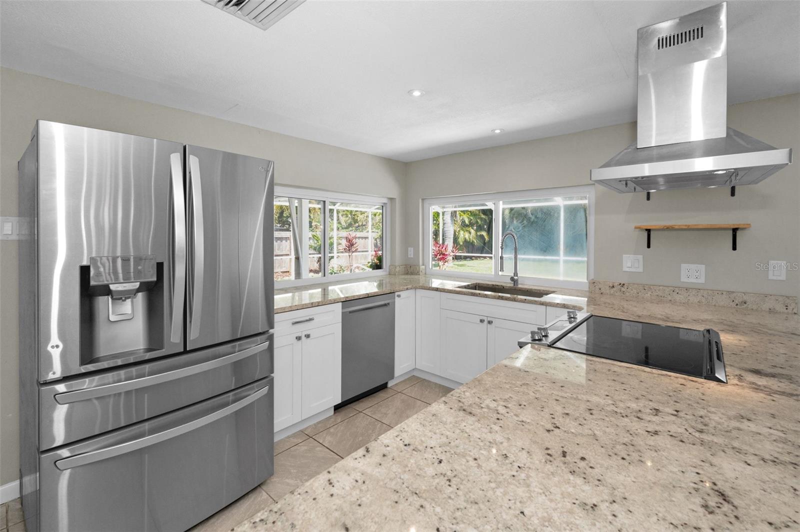 Gorgeous updated kitchen with tons of cabinet space, cooking island and breakfast bar with room for 4 stools.