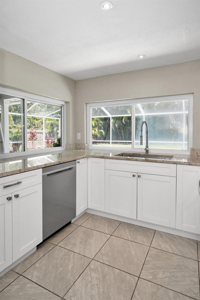 Stainless steel appliances and hood vent.