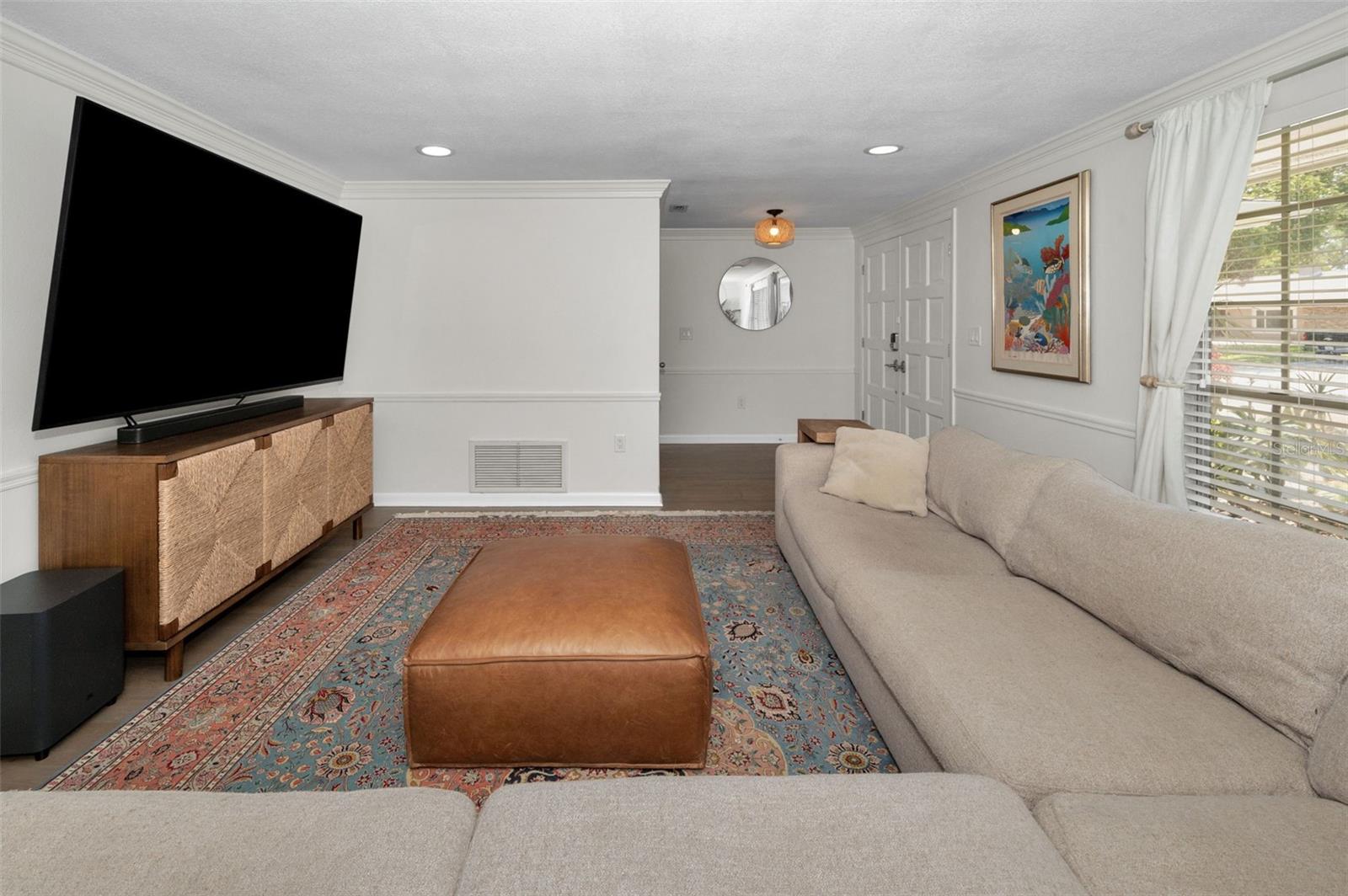 Large entrance foyer with coat closet.