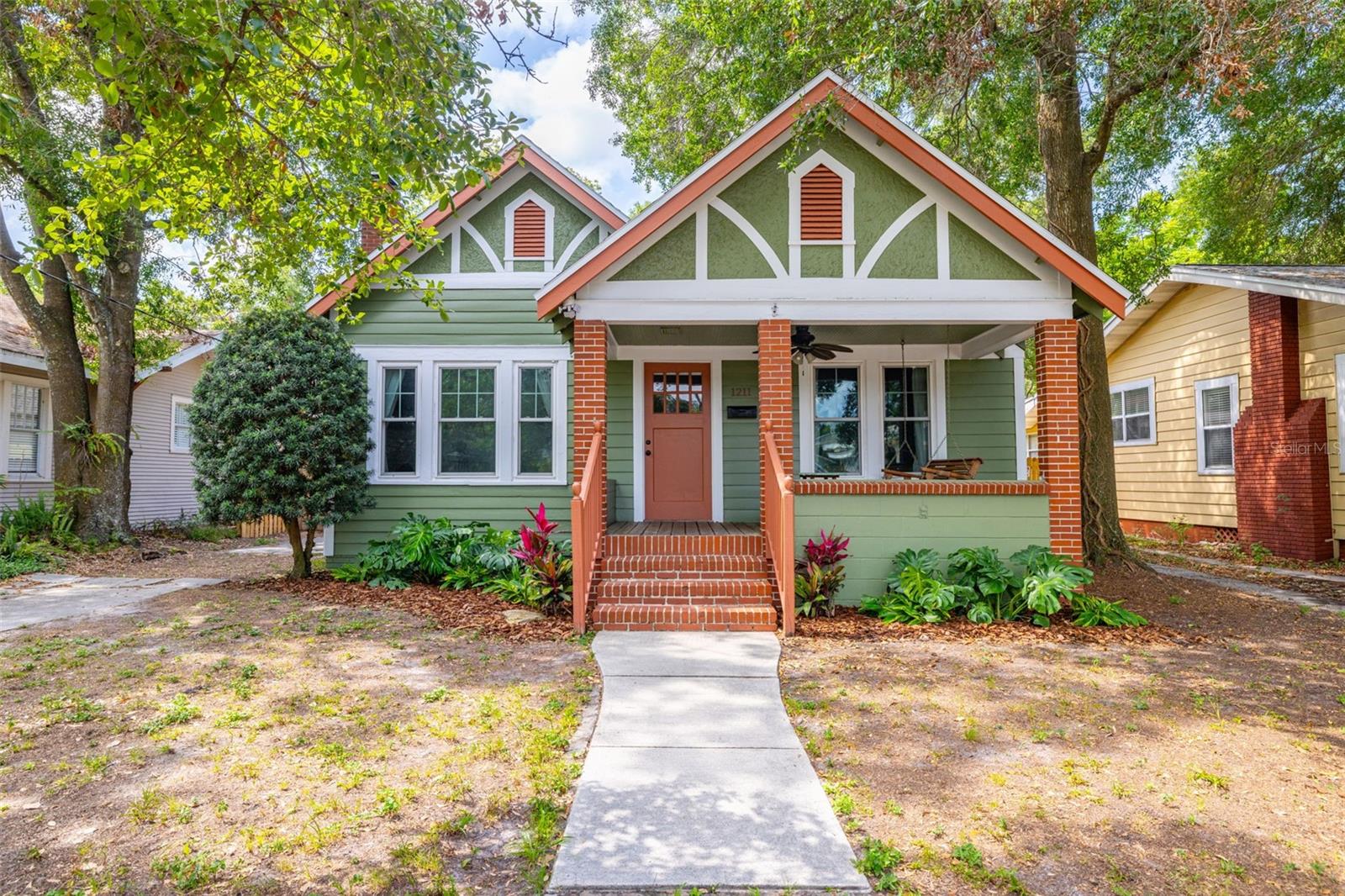 Welcome to this charming bungalow with brand new roof and hurricane-rated windows.