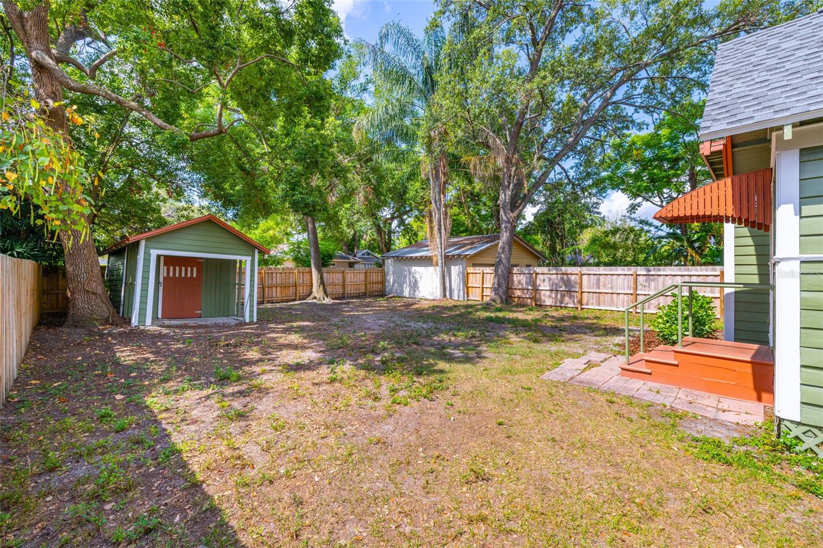 A spacious backyard with new fencing and a blank canvas for your ideas.