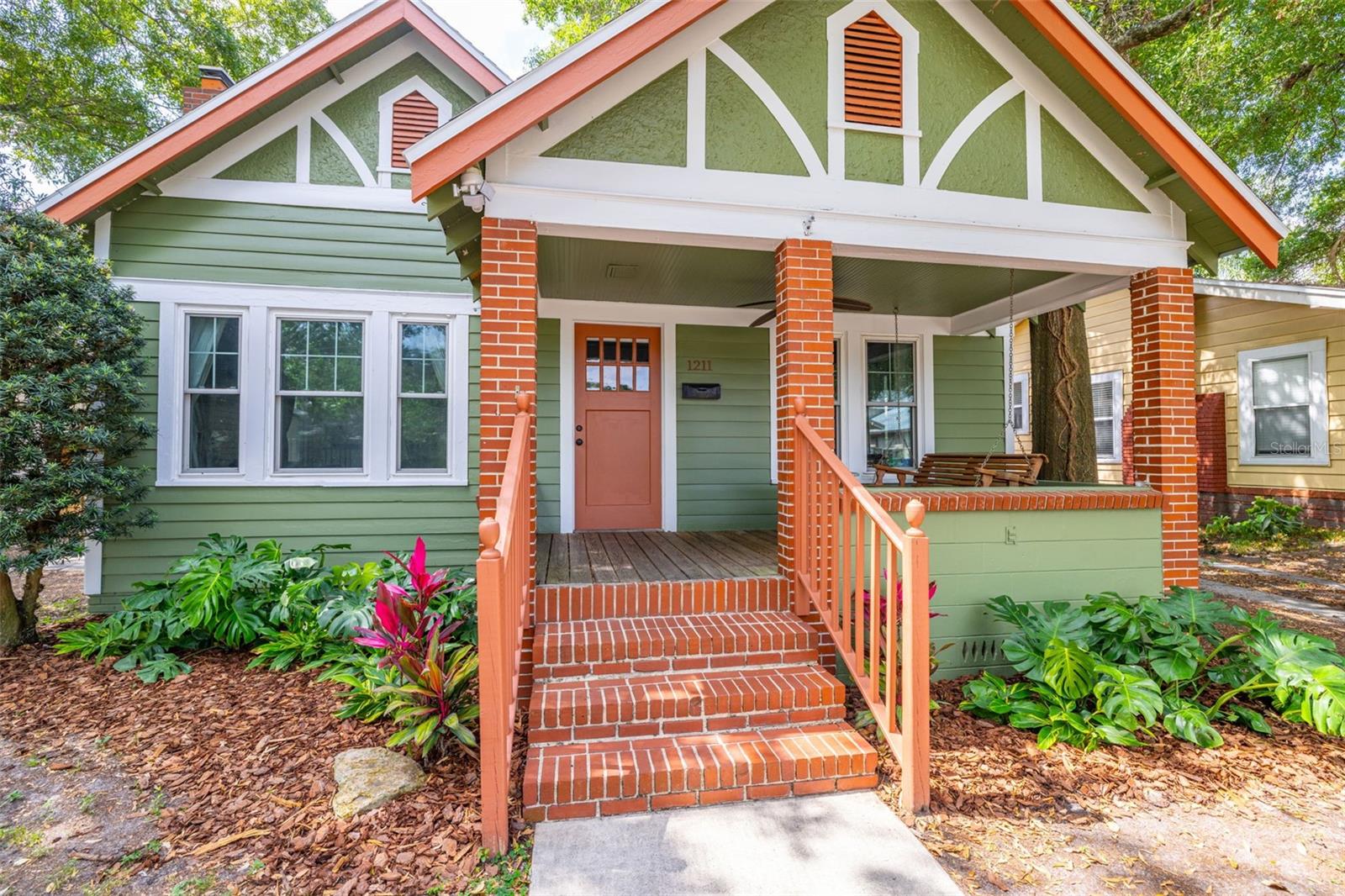 A covered porch with swing awaits you.