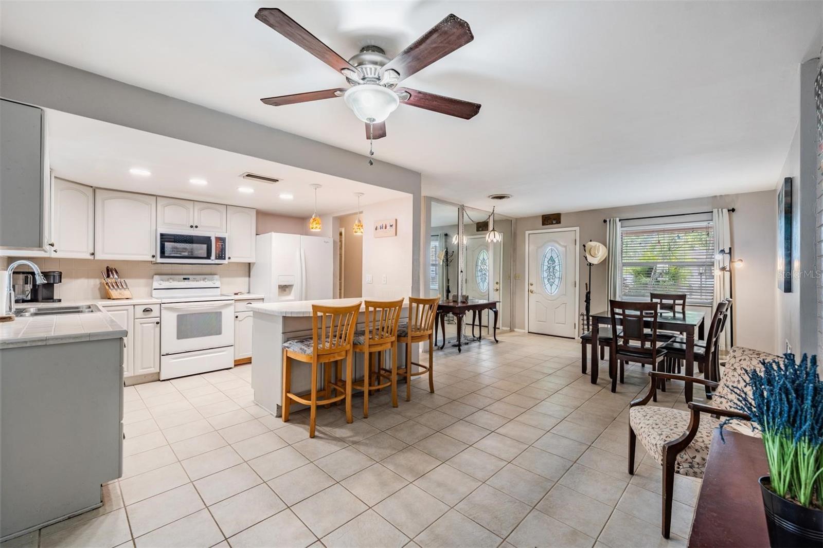 The inviting living room, dining room, and kitchen create an open, inviting space perfect for everyday living and entertaining.