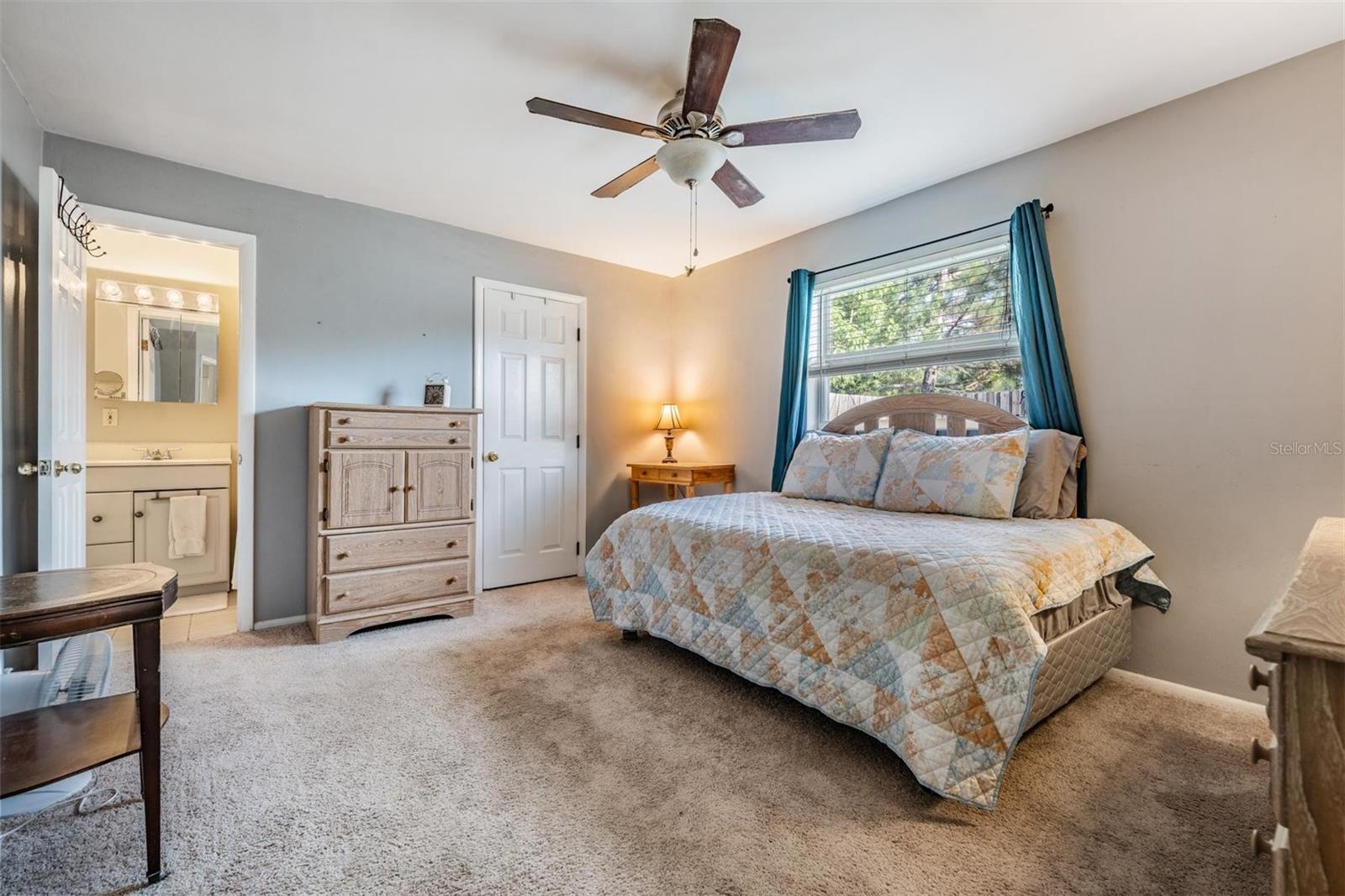 The primary bedroom suite is thoughtfully separated from the other bedrooms, offering added privacy and a peaceful retreat.