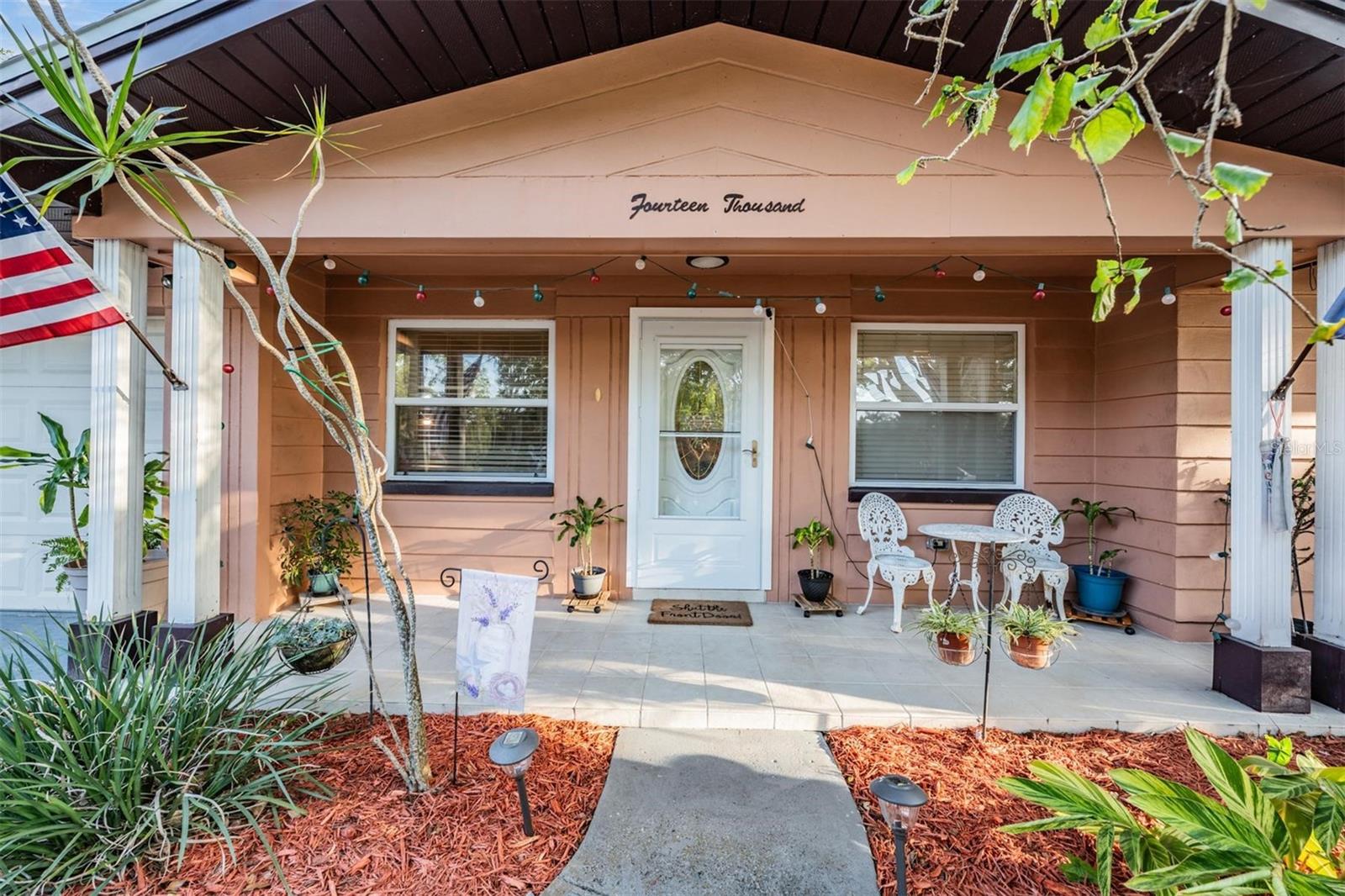 The charming covered front porch is the perfect spot to relax with your morning coffee or unwind in the evening breeze.