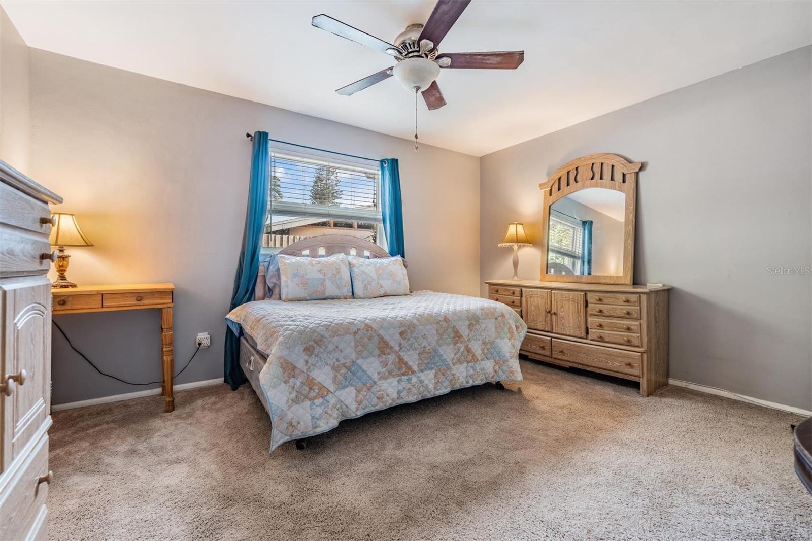 The large primary bedroom offers ample space for relaxation.