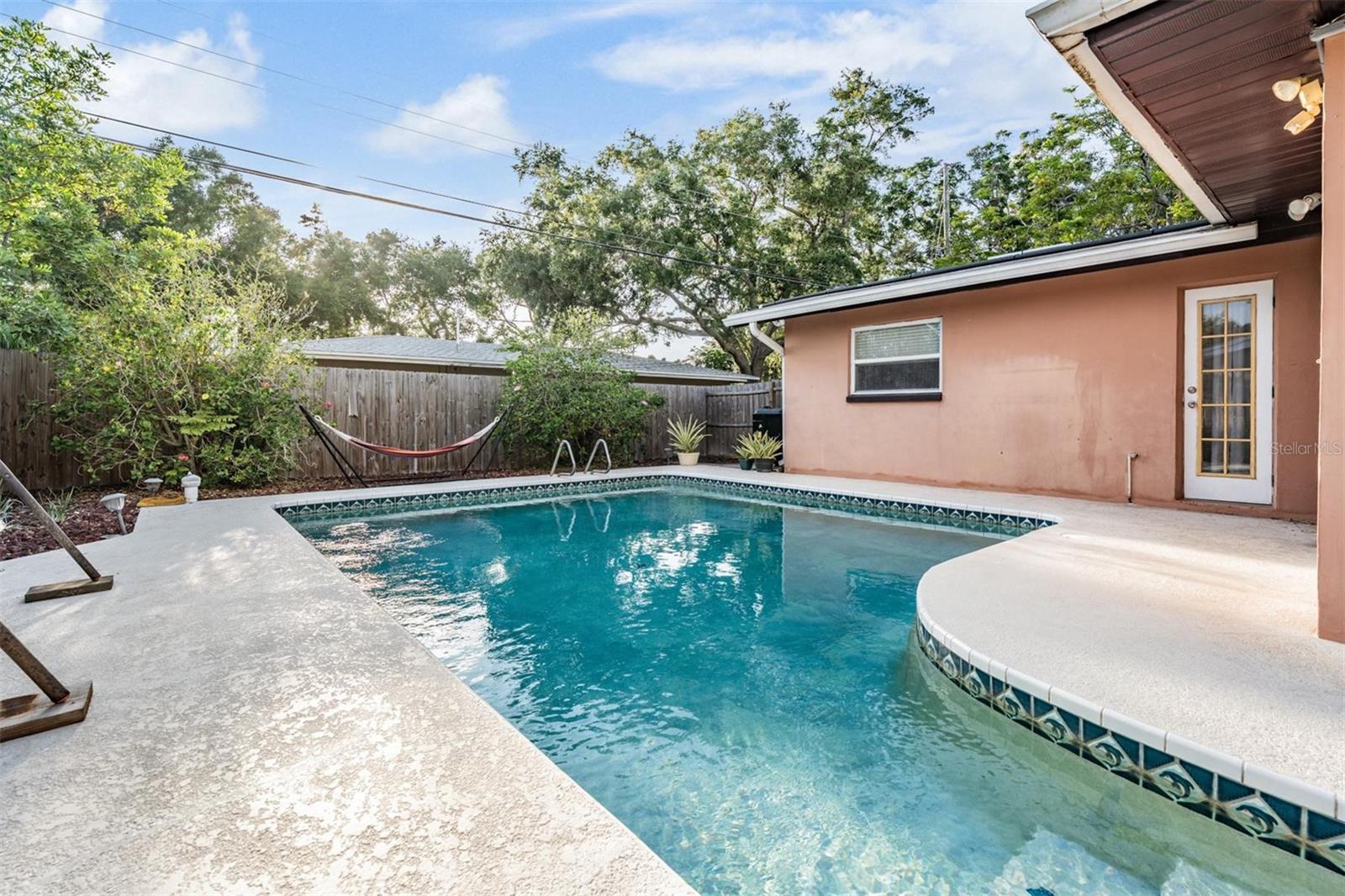 The heated pool offers the luxury of year-round enjoyment, making it easy to take a dip on a cool winter day or unwind with a peaceful evening swim under the stars
