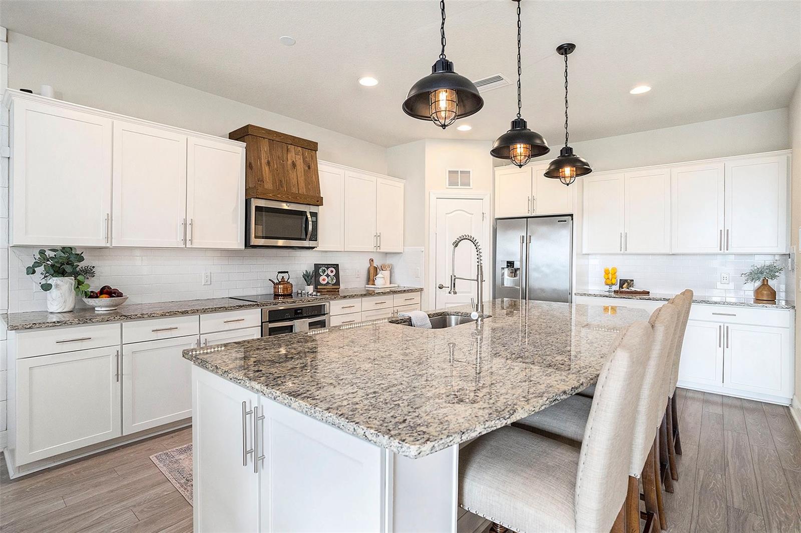 Perfect kitchen...extra large, granite counters, counter height, large kitchen pantry, under cabinet lighting, and smart home features
