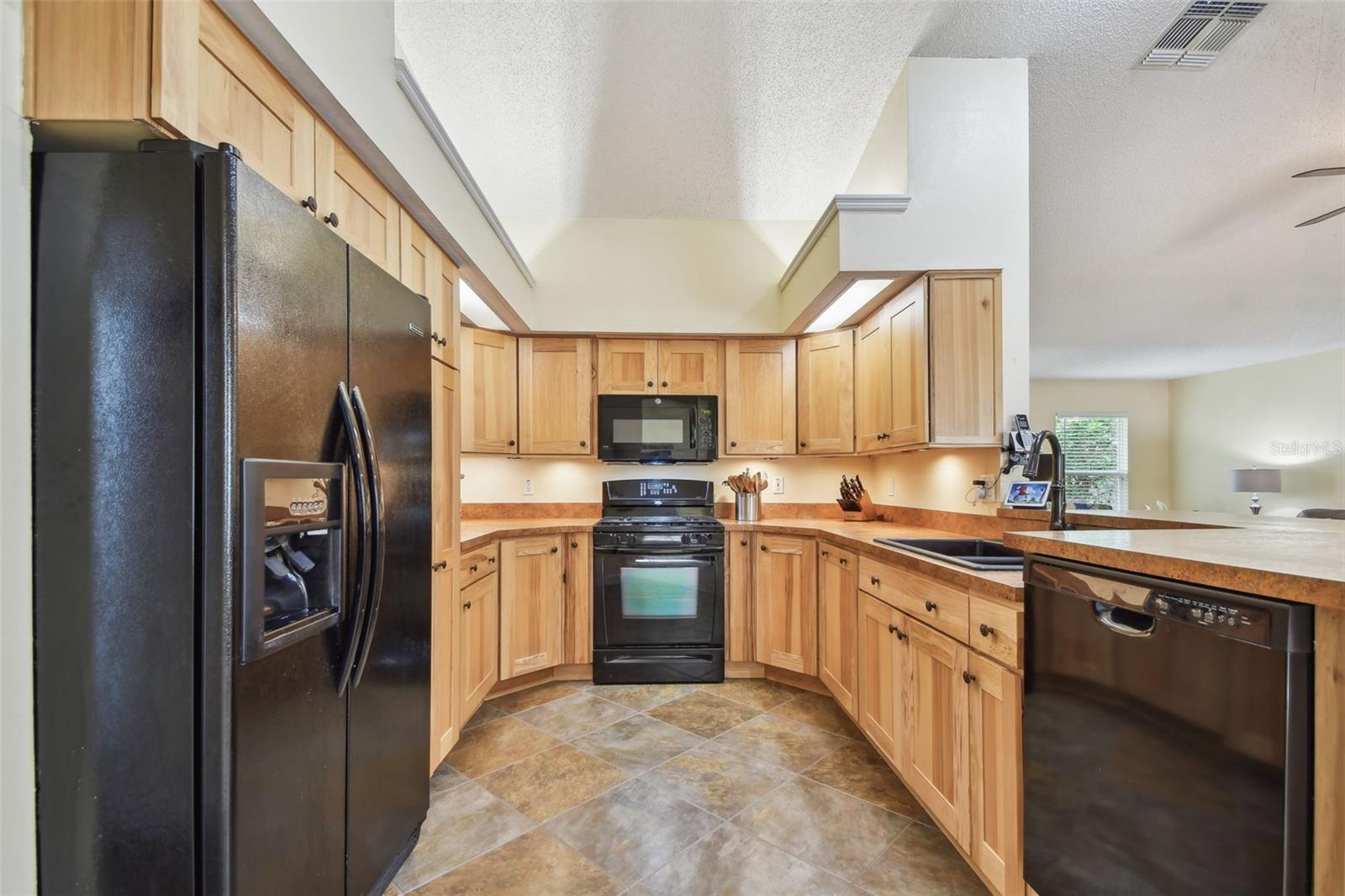 Welcoming kitchen with hickory cabinets - ready for you to create some amazing meals.