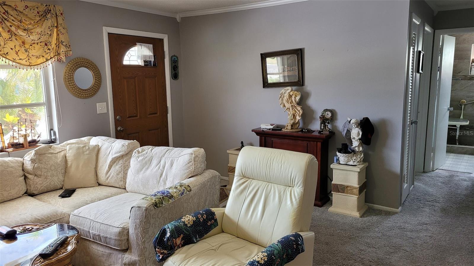View of the living Room and front door from the dining area.