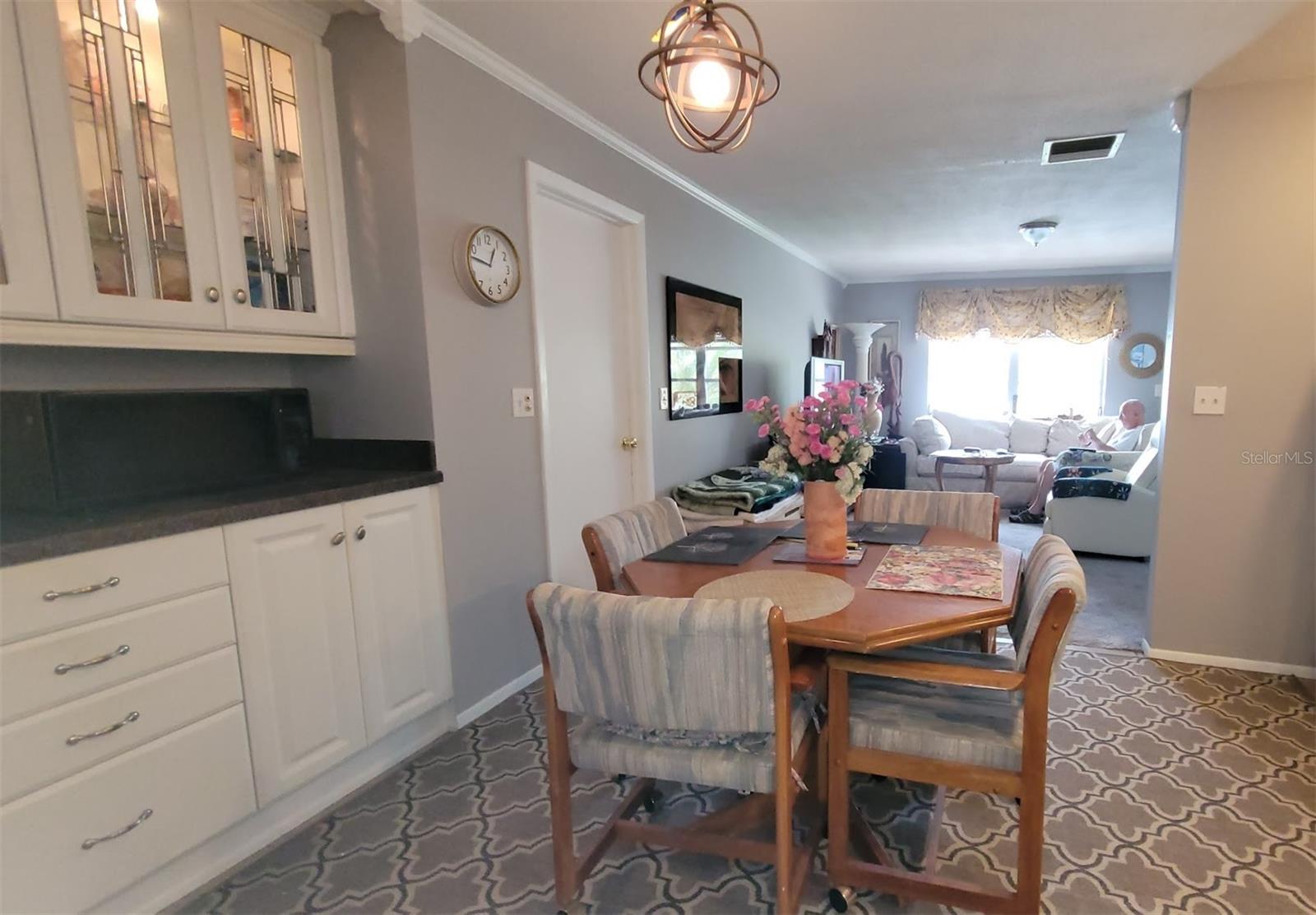 The kitchen has lots of cabinets and counter space as well as room for a table and 4 chairs.