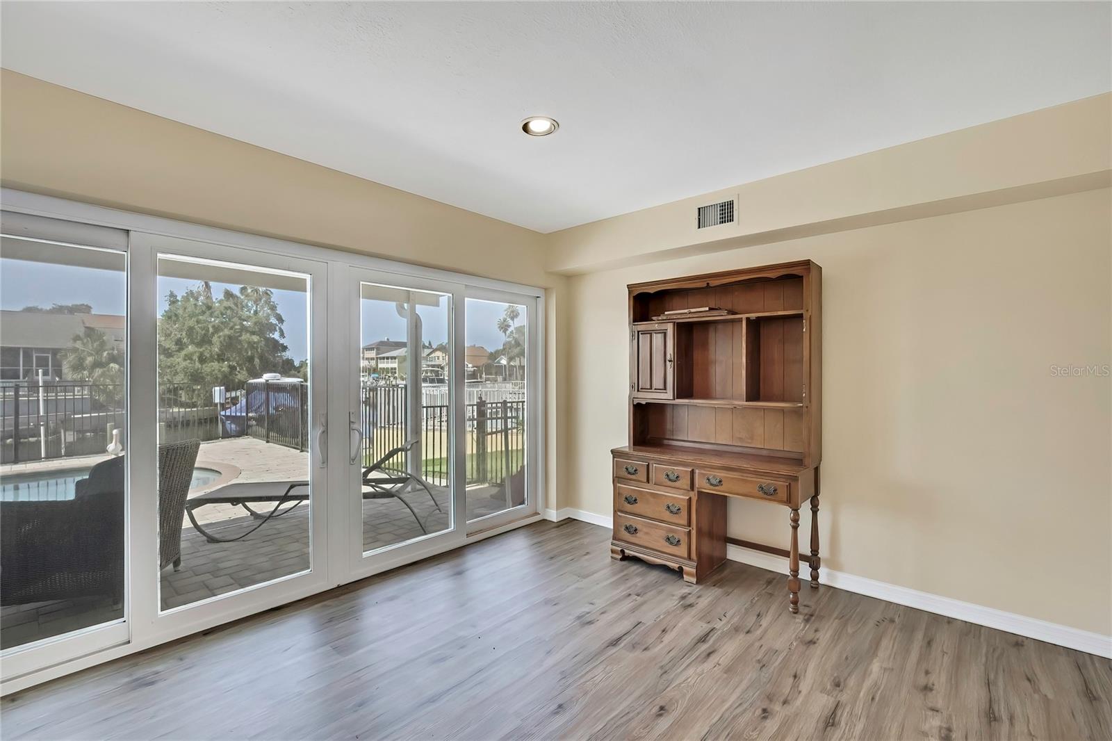 Ground floor bedroom 1 with walk out to pool deck