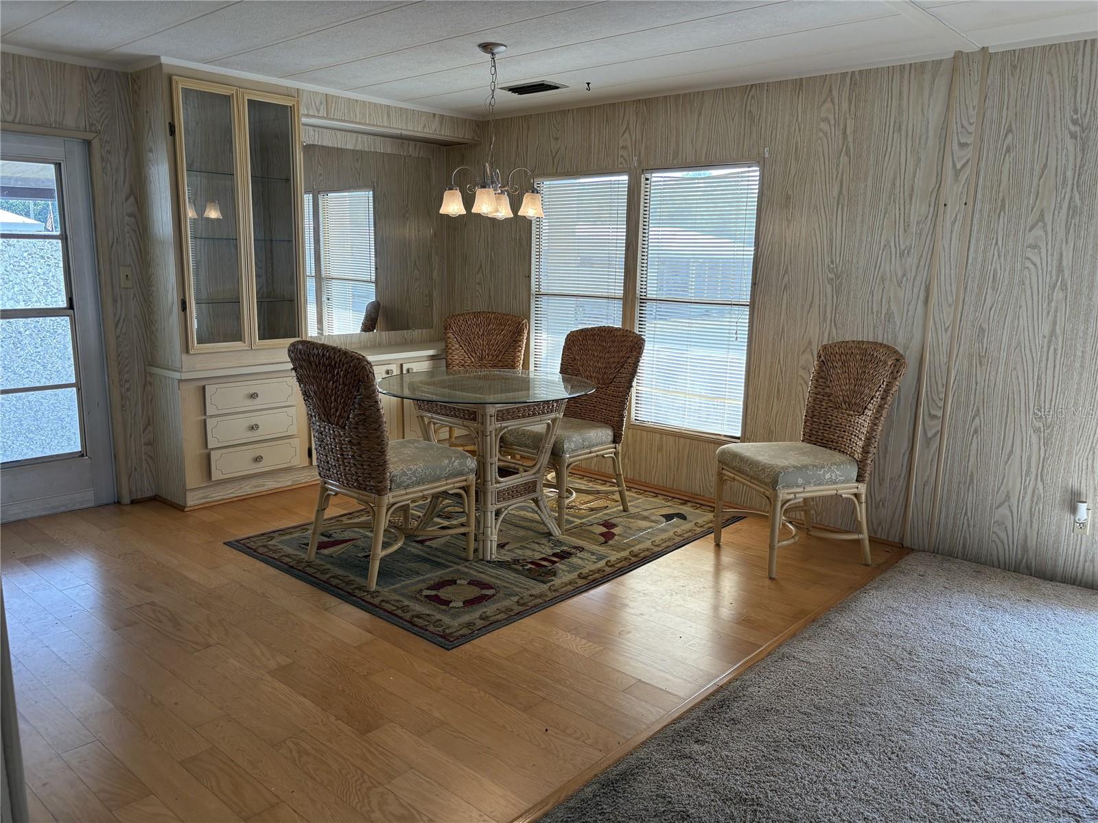 Built in hutch and Wood floors in dining area