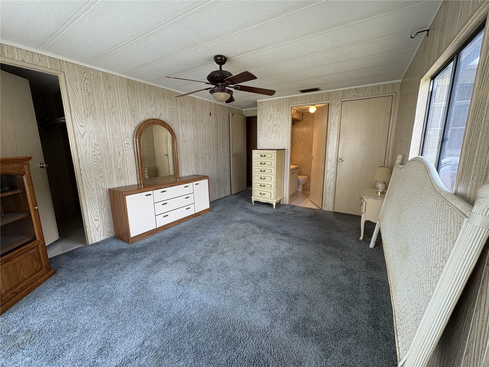 Partially furnished primary bedroom