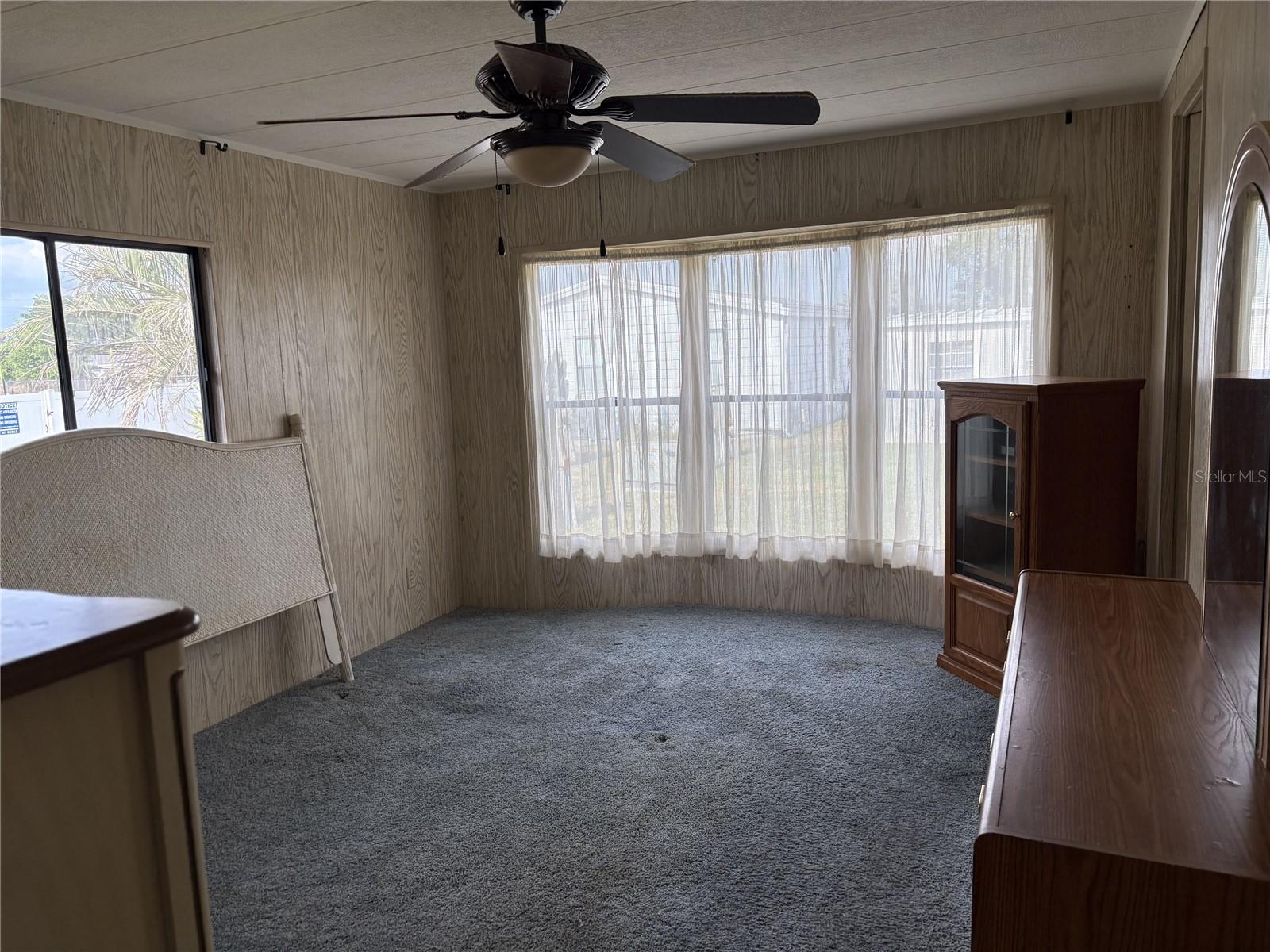bay window overlooks backyard