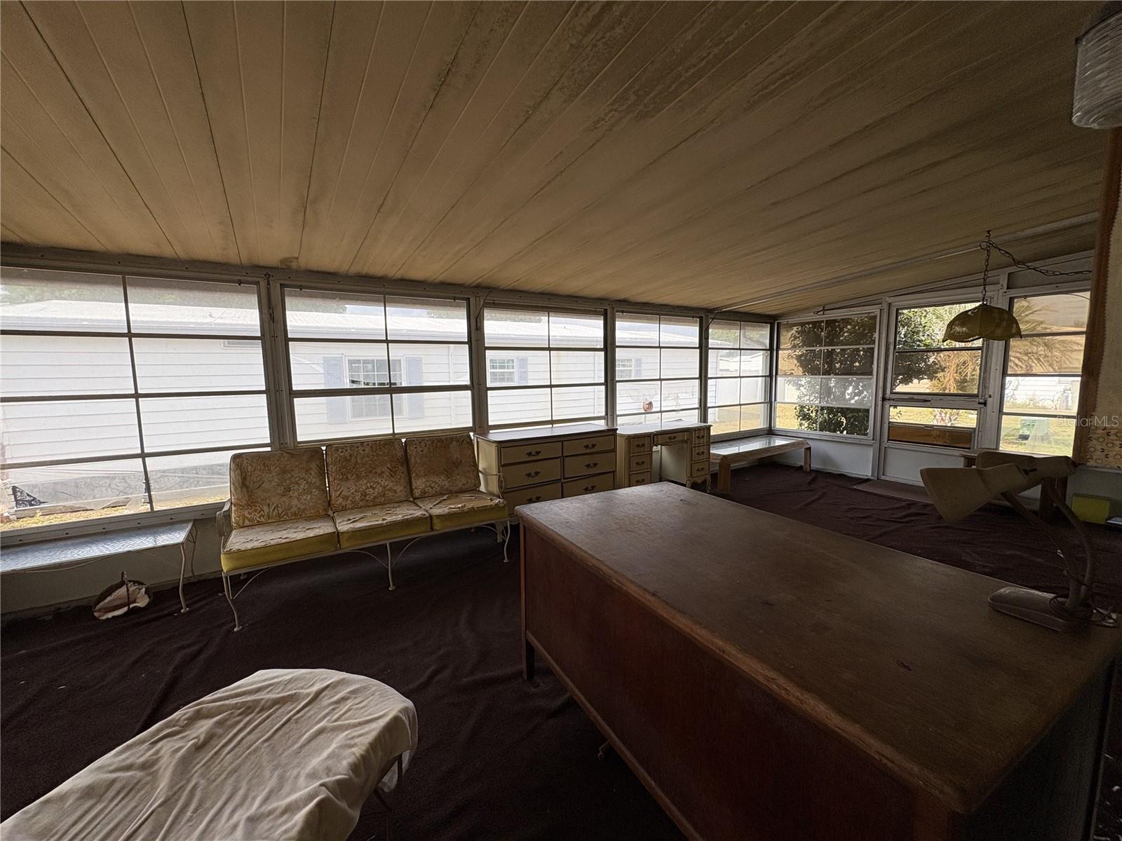 Enclosed Florida room with vinyl windows