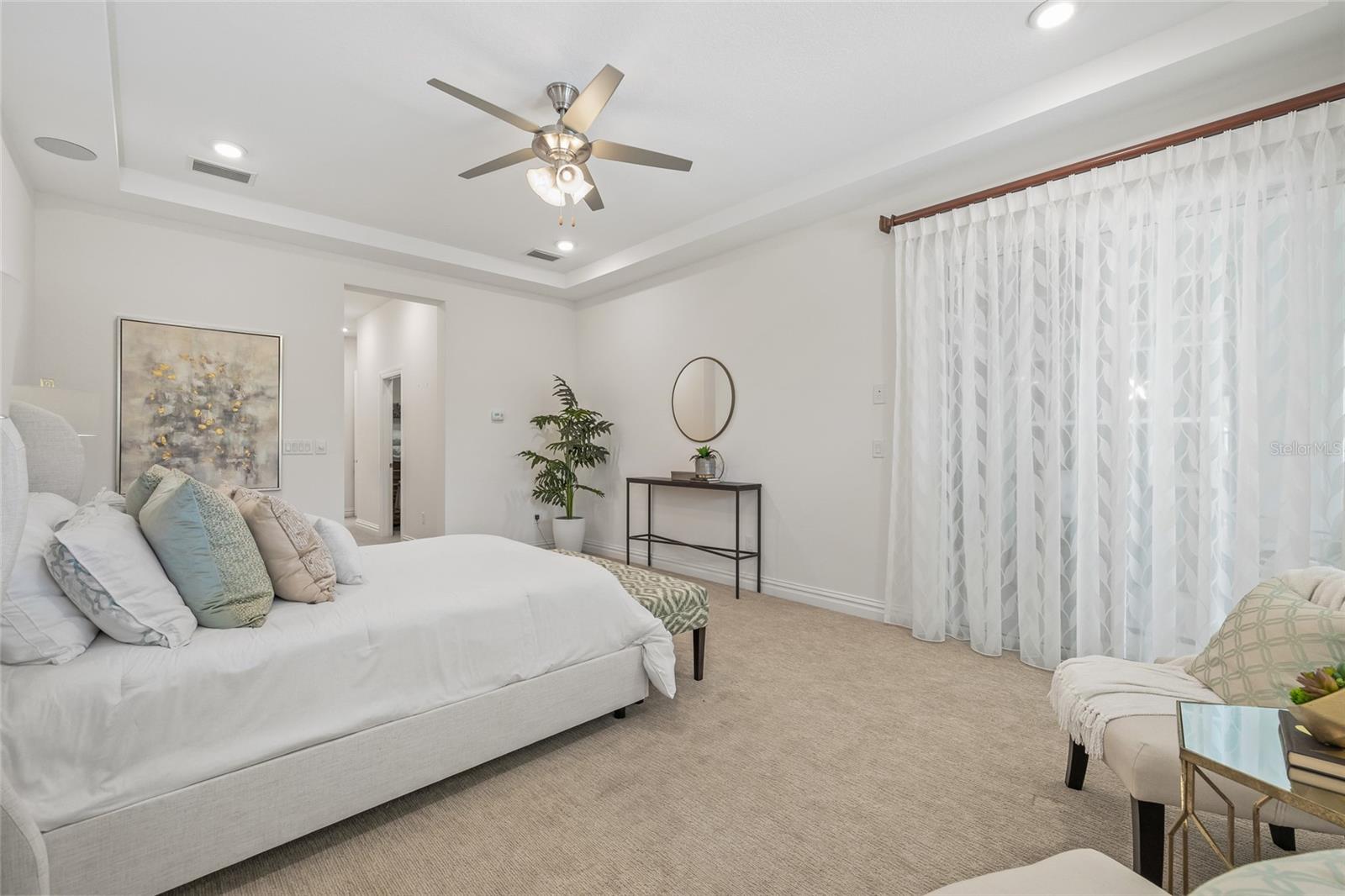 Primary suite with slider leading to the pool