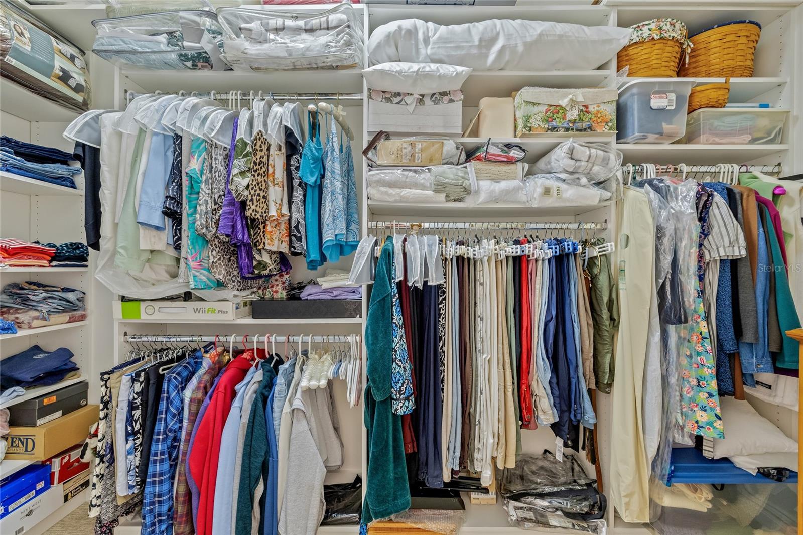 One of two walk in closet with closet systems in place