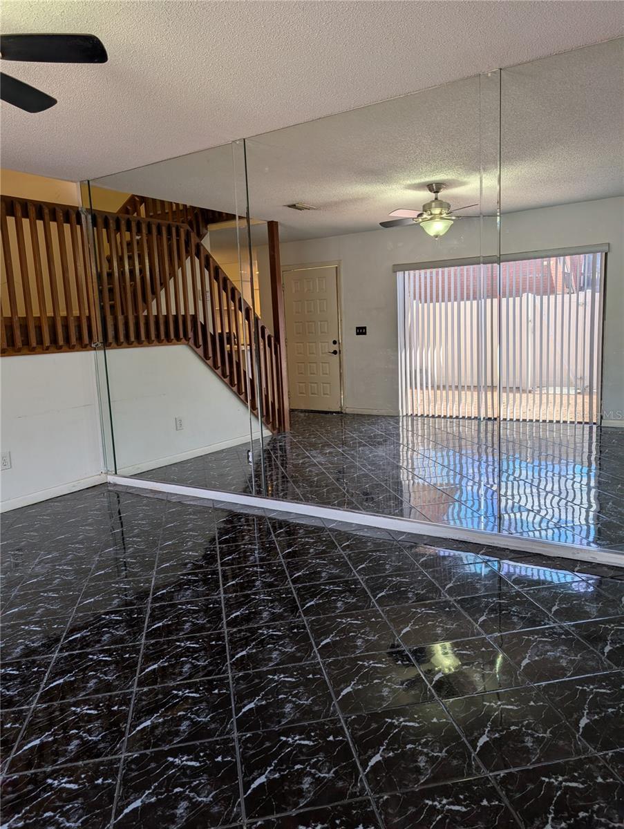 Living area with gorgeous mirrored walls.