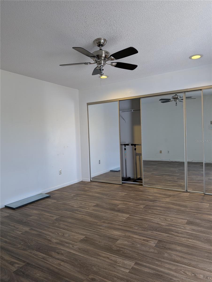 Primary Bedroom with sliding miirored closet doors