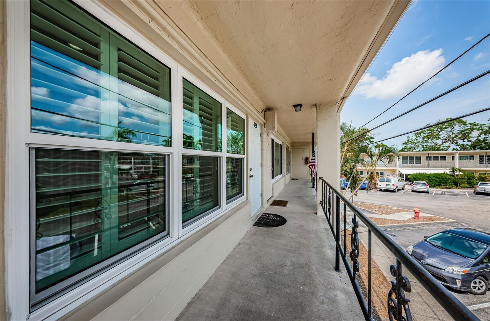 Front door with hurricane windows and storm dooor