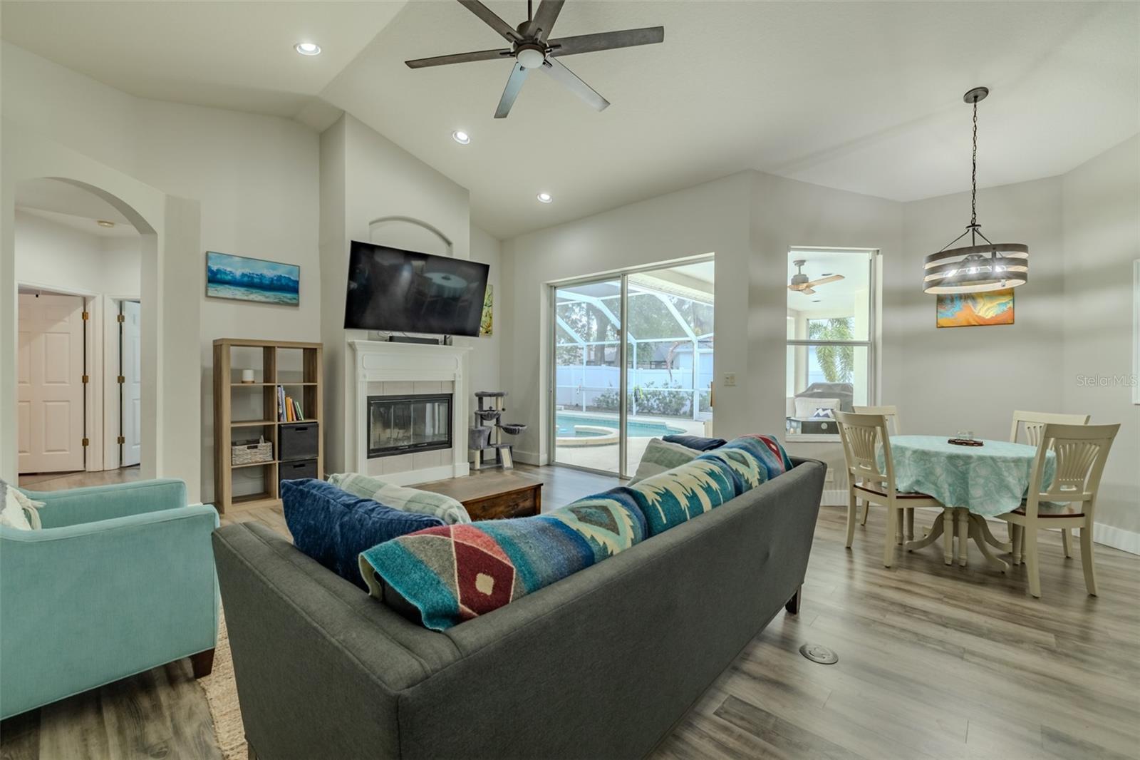 Updated Family Room ceiling fan... Look at those vaulted ceilings!
