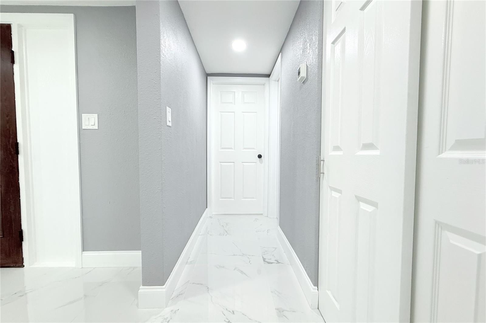 HALL TO GUEST BATHROM AND 2ND BEDROOM